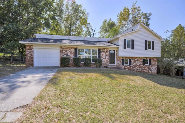 split level home with a garage and a front lawn