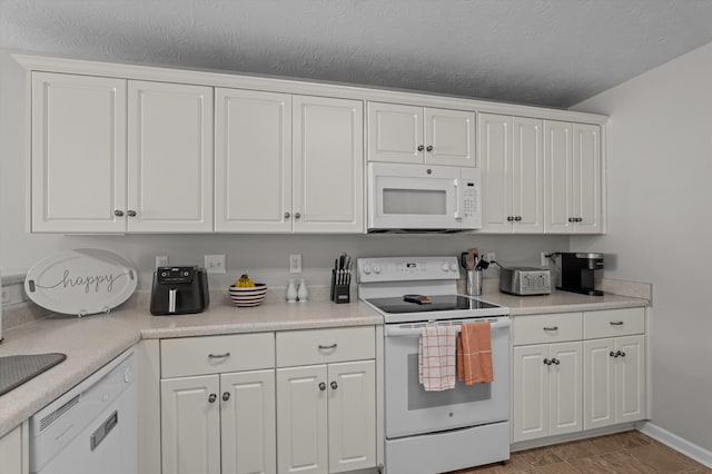 361 Redbud Dr, North Augusta, SC 29860 - kitchen with light countertops, white cabinetry, and white appliances