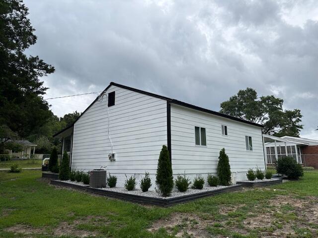 875 Earle St, Thomson, GA 30824 - view of side of home featuring central AC