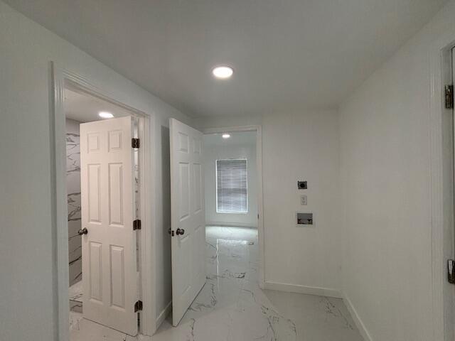 875 Earle St, Thomson, GA 30824 - corridor with recessed lighting, baseboards, and light marble finish flooring