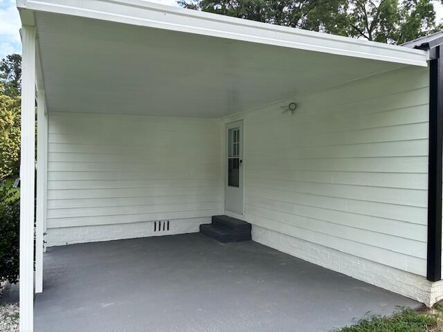 875 Earle St, Thomson, GA 30824 - view of patio featuring a carport and entry steps