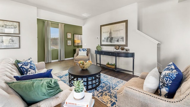 living room with wood finished floors and baseboards