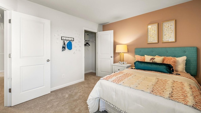 bedroom with carpet floors, a closet, and baseboards