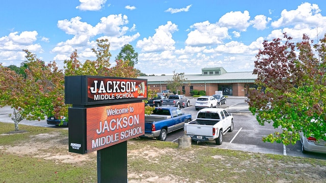 exterior details with a parking lot