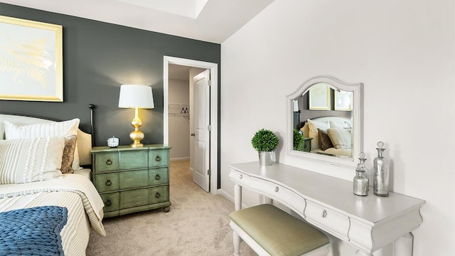 bedroom featuring light carpet and baseboards