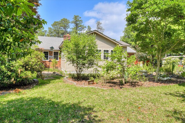 101 Hartwell Dr, Aiken, SC 29803 - view of front facade with a front yard, a chimney, and brick siding