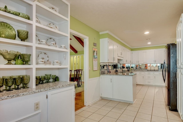 101 Hartwell Dr, Aiken, SC 29803 - kitchen with white cabinets, light tile patterned floors, open shelves, a wainscoted wall, and light stone countertops