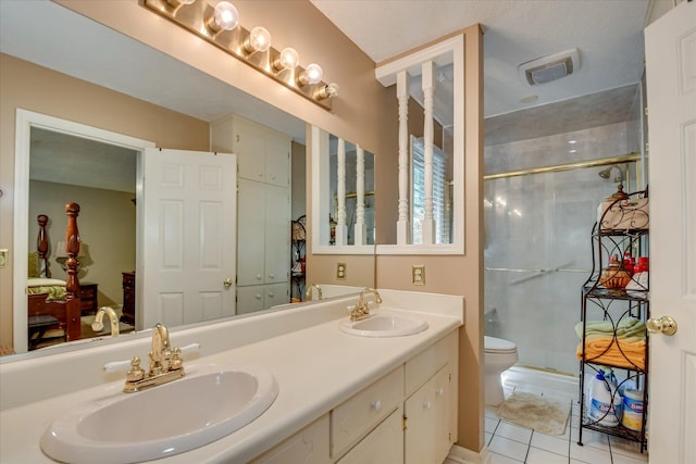 101 Hartwell Dr, Aiken, SC 29803 - bathroom with a stall shower, tile patterned flooring, double vanity, and toilet