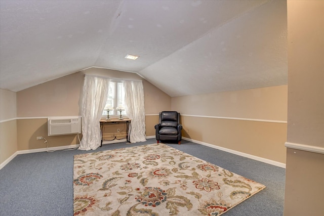 101 Hartwell Dr, Aiken, SC 29803 - living area featuring vaulted ceiling, carpet floors, an AC wall unit, and baseboards