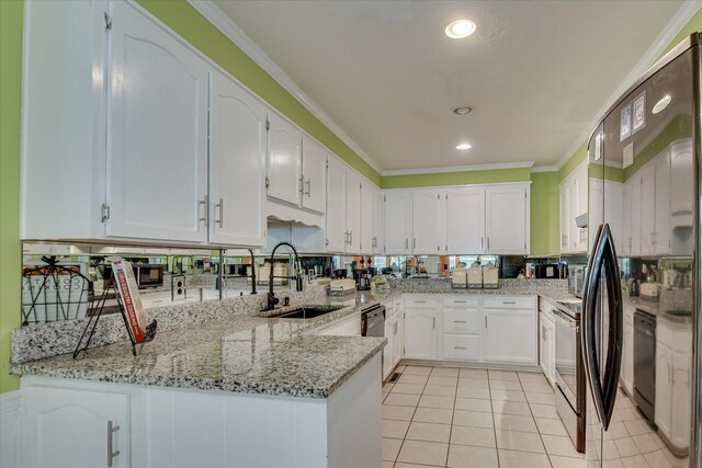 101 Hartwell Dr, Aiken, SC 29803 - kitchen featuring a sink, black appliances, white cabinets, ornamental molding, and light stone countertops