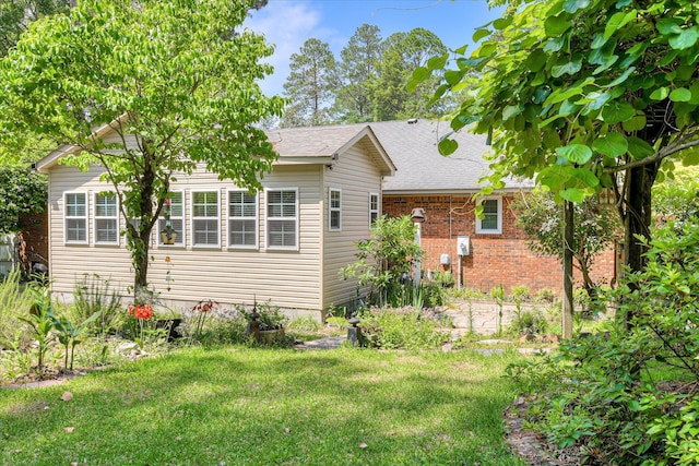101 Hartwell Dr, Aiken, SC 29803 - back of house with a yard, a shingled roof, and brick siding