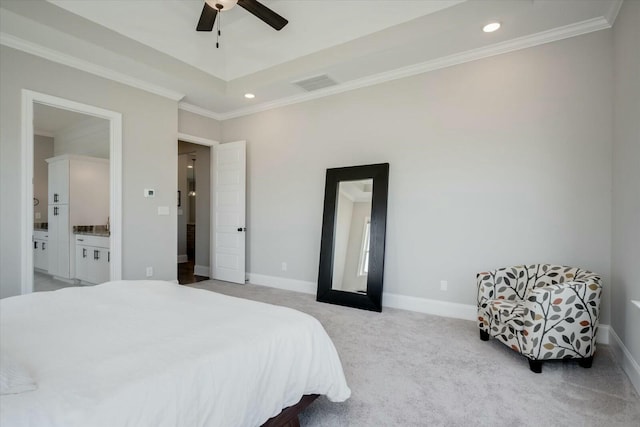 bedroom featuring light carpet, visible vents, baseboards, ensuite bath, and crown molding