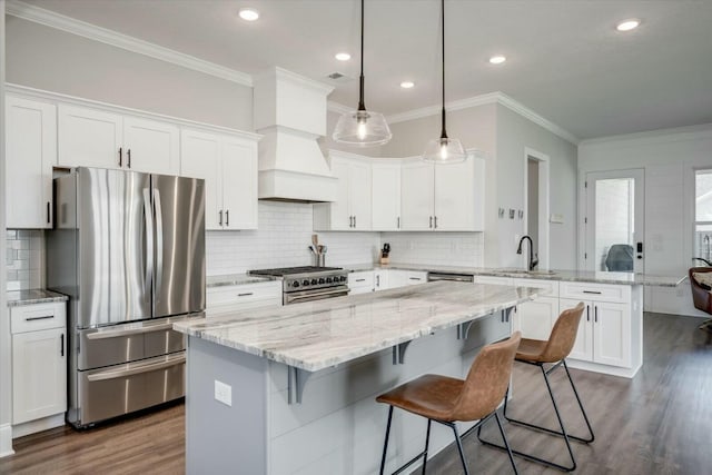 kitchen featuring stainless steel appliances and white cabinetry