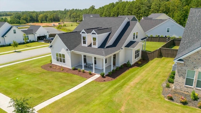 bird's eye view with a wooded view