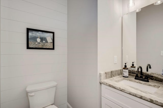 bathroom with toilet and vanity