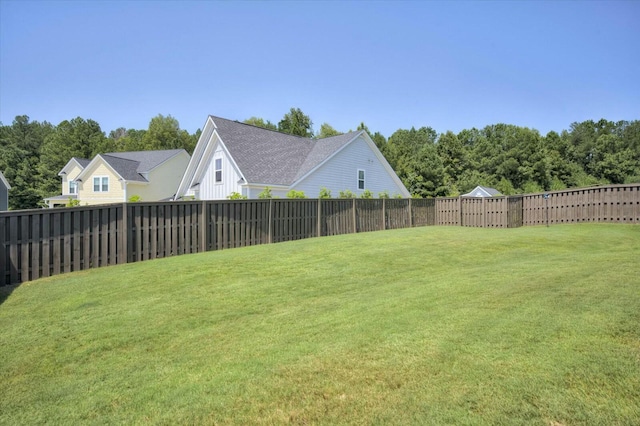 view of yard with a fenced backyard