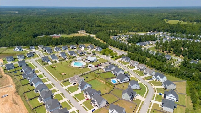 bird's eye view with a forest view and a residential view