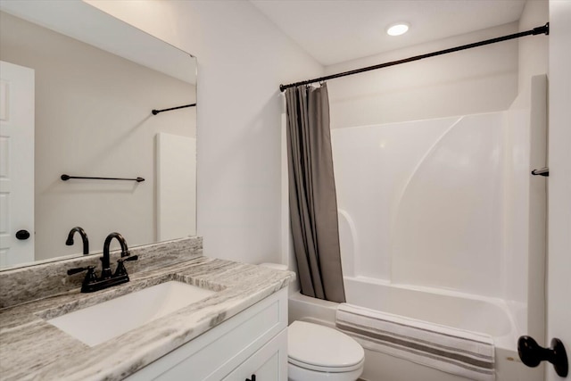 full bath with toilet, vanity, and shower / tub combo with curtain