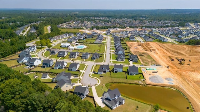 bird's eye view with a water view and a residential view