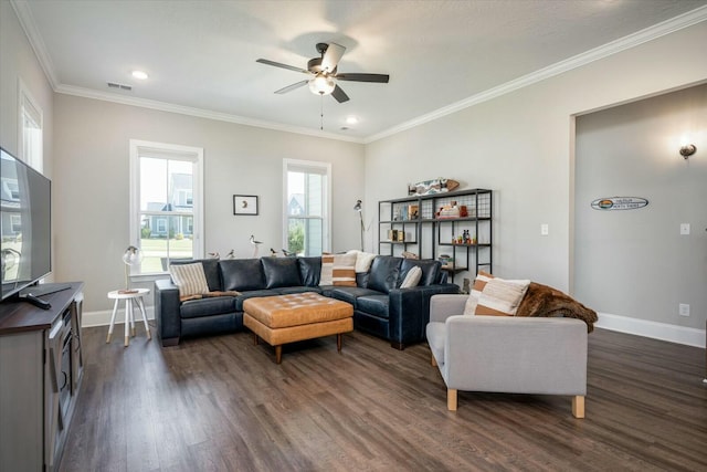 living room featuring dark wood-type flooring, visible vents, crown molding, and baseboards