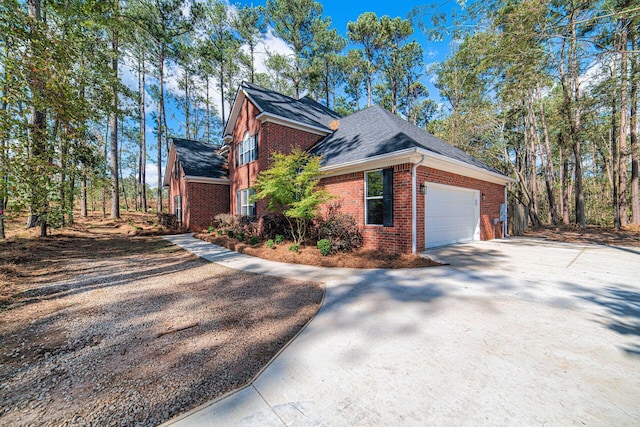 view of side of home with a garage