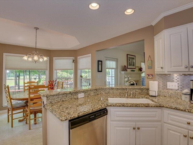 kitchen with white cabinetry, dishwasher, sink, a notable chandelier, and plenty of natural light