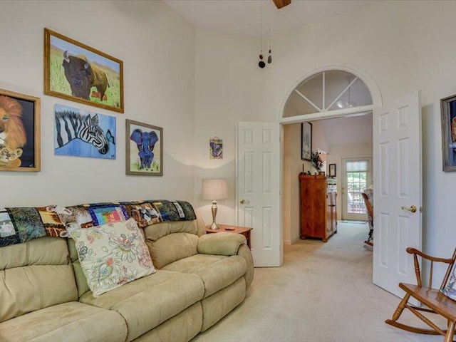 living room featuring light colored carpet and lofted ceiling