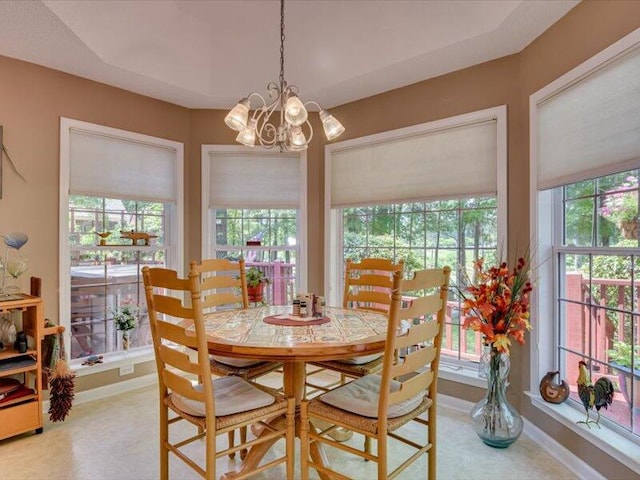 dining area featuring an inviting chandelier