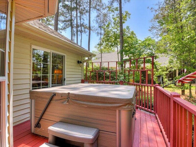 wooden terrace with a hot tub