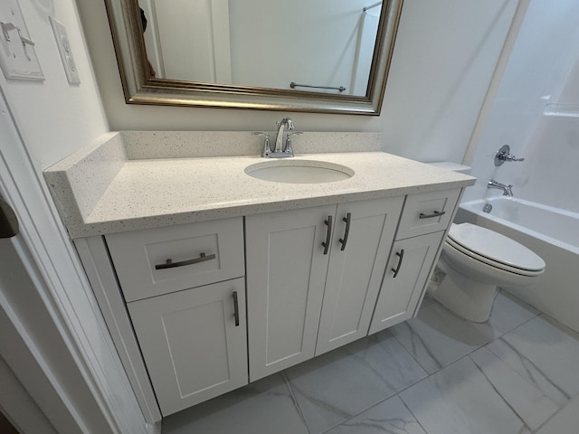 bathroom with toilet, marble finish floor, washtub / shower combination, and vanity