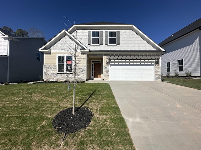 view of front of property featuring a garage, stone siding, concrete driveway, and a front yard