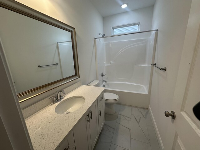 bathroom with marble finish floor, toilet, vanity, shower / tub combination, and baseboards