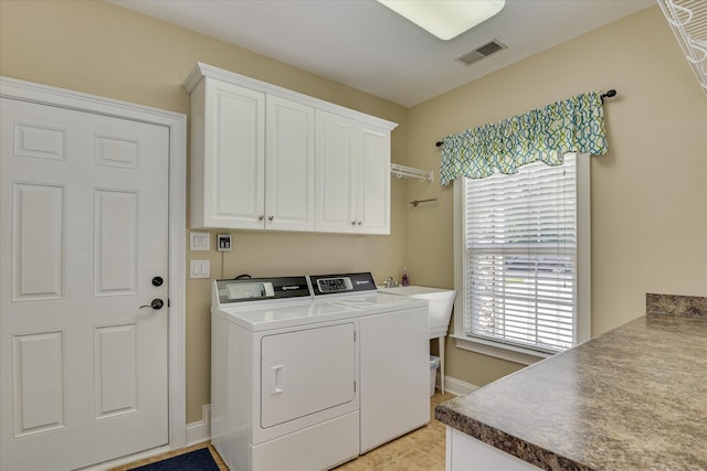136 Lake Ridge Dr, Mccormick, SC 29835 - laundry room featuring cabinet space, washing machine and dryer, baseboards, and light tile patterned floors