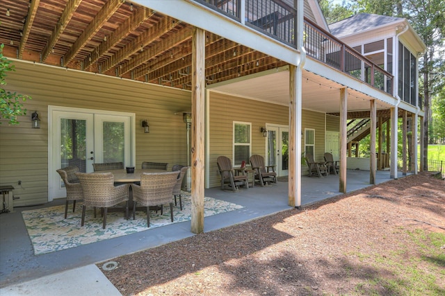 136 Lake Ridge Dr, Mccormick, SC 29835 - view of patio with french doors, a sunroom, outdoor dining area, and a deck