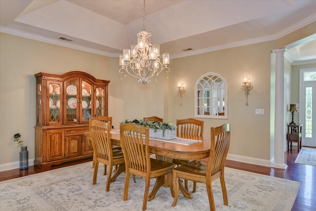136 Lake Ridge Dr, Mccormick, SC 29835 - dining area with wood finished floors, ornamental molding, a chandelier, a raised ceiling, and baseboards