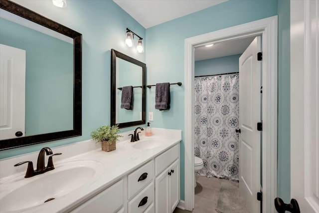 bathroom featuring vanity, tile patterned flooring, toilet, and walk in shower