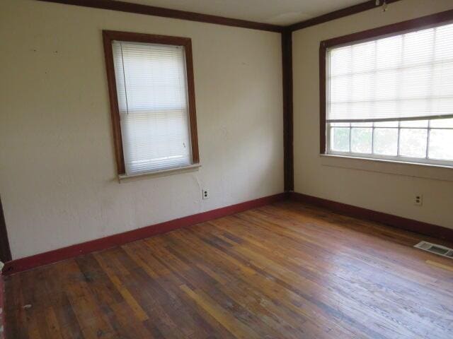1466 Dewitt St, Augusta, GA 30901 - empty room with wood finished floors and baseboards