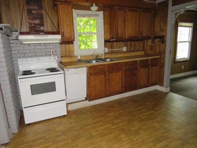 1466 Dewitt St, Augusta, GA 30901 - kitchen featuring white appliances, under cabinet range hood, healthy amount of natural light, and light wood-style flooring