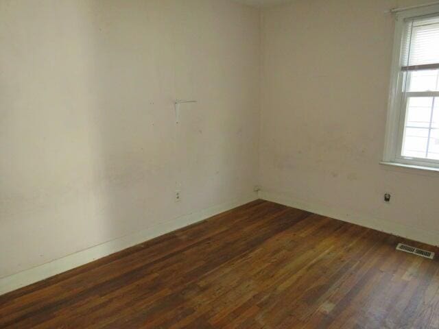 1466 Dewitt St, Augusta, GA 30901 - unfurnished room with dark wood-style flooring and baseboards