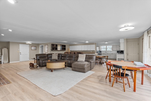 living room with light hardwood / wood-style flooring