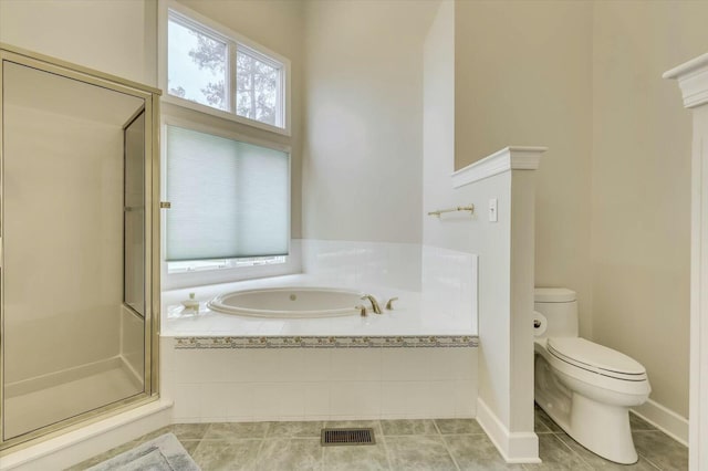 bathroom with tile patterned floors, independent shower and bath, and toilet