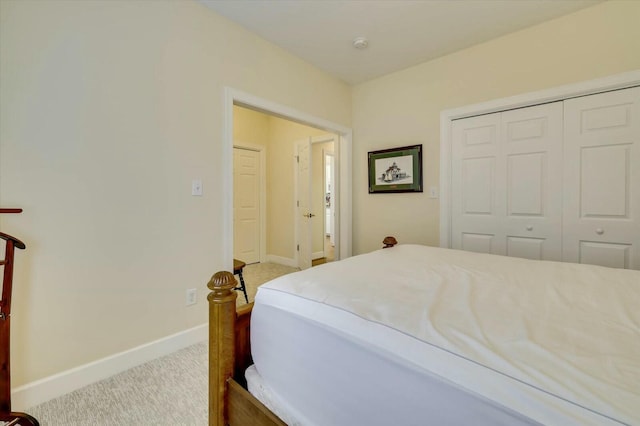 carpeted bedroom with a closet