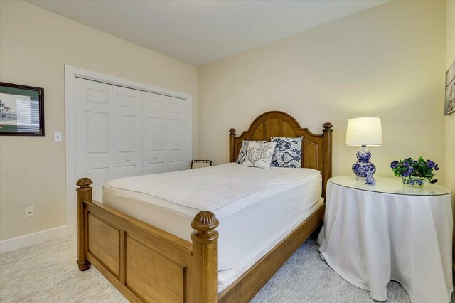 carpeted bedroom featuring a closet