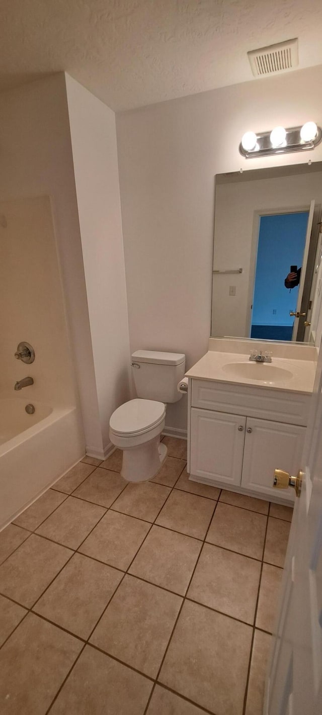 231 Lynbrook Way, Grovetown, GA 30813 - bathroom with toilet, tile patterned floors, vanity, a textured ceiling, and bathtub / shower combination