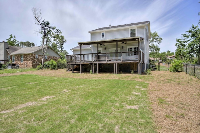 rear view of property with a ceiling fan, a wooden deck, and stairway