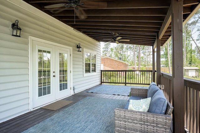 deck with french doors and ceiling fan