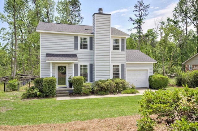 view of front facade featuring a shingled roof, an attached garage, and a chimney