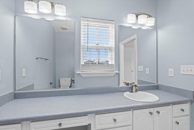 bathroom with vanity and toilet