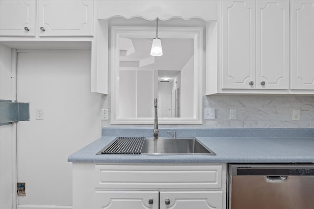 kitchen with sink, dishwasher, hanging light fixtures, white cabinets, and decorative backsplash