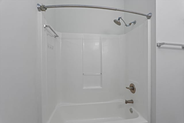 bathroom with shower / bath combination